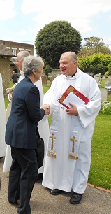 Rev. Gary Ingram greeting visitors to the church